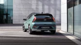 Modern green urban hatchback with sporty design reflecting sustainable, innovative city mobility.