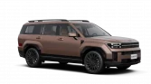 Bronze‑metallisches Hyundai Hybrid‑SUV, Dreiviertel‑Frontansicht im Studio vor schwarzem Hintergrund