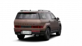 Bronzefarbenes Hyundai‑SUV Hybrid, Heck‑Dreiviertelansicht vor schwarzem Hintergrund